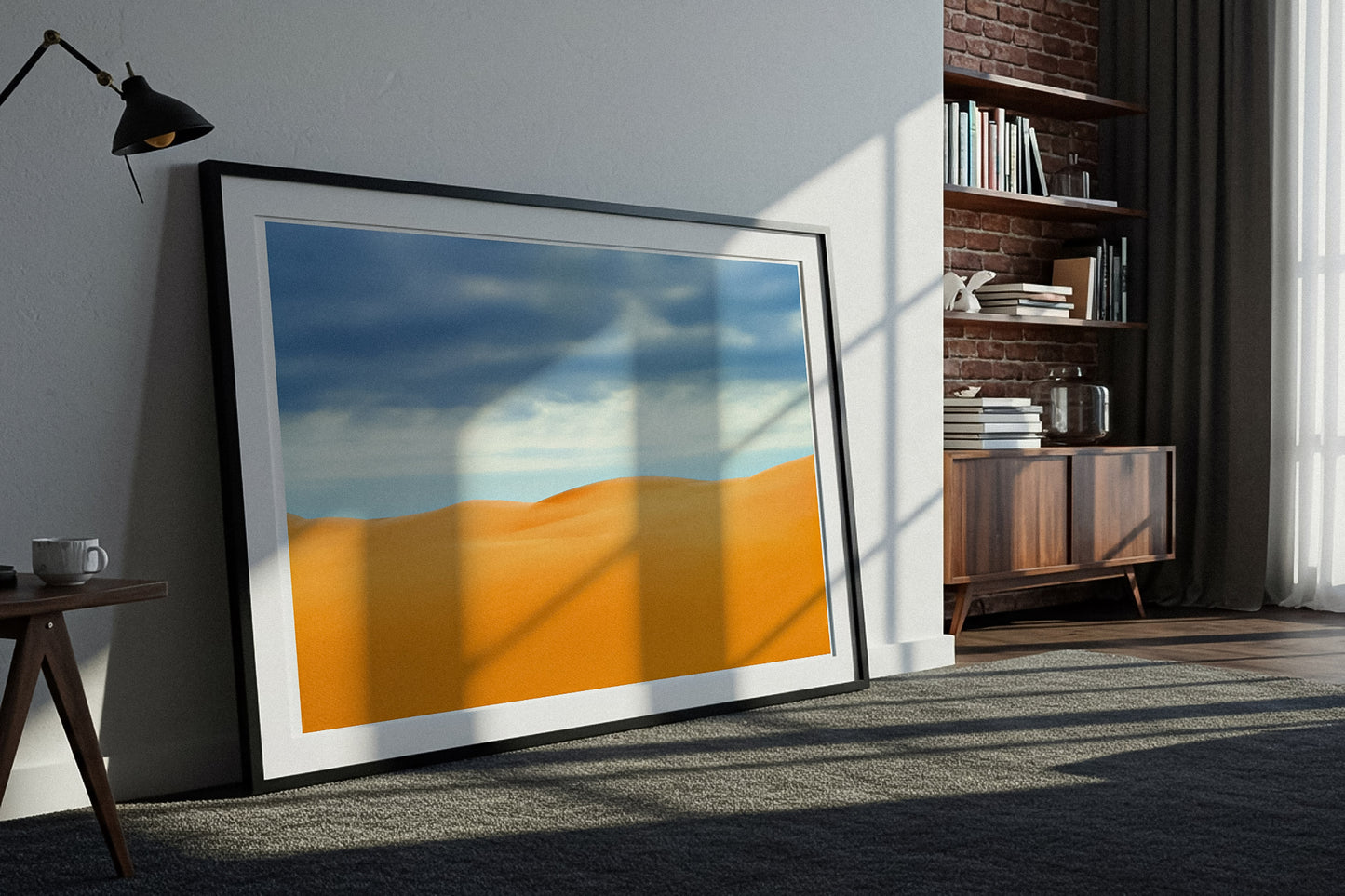 Framed fine art photography print of a desert landscape in a modern room.