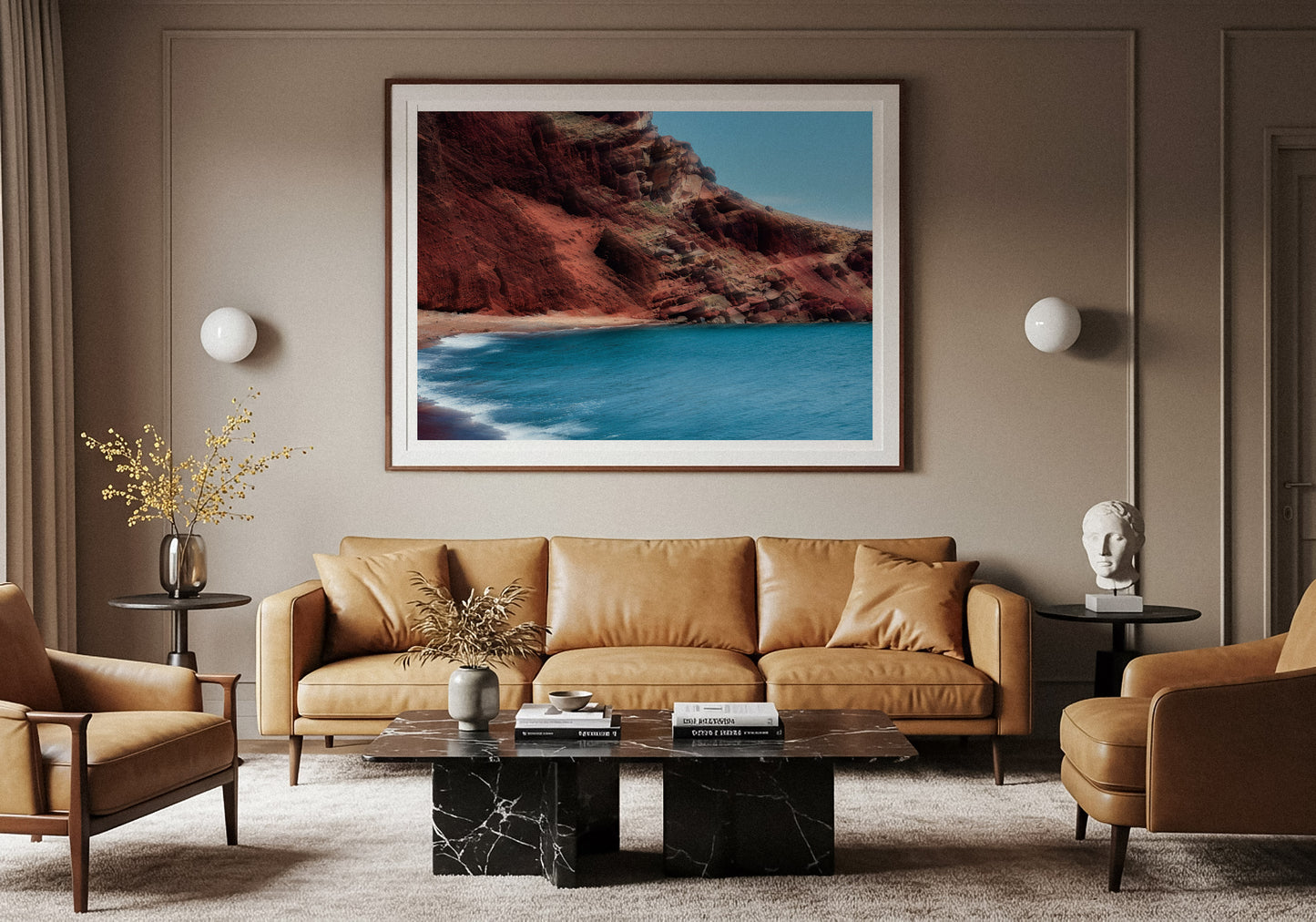 Living room with a sofa, armchairs, and a large framed picture of a Red beach Landscape Photography by Lucas Castro Pardo hanging on a wall