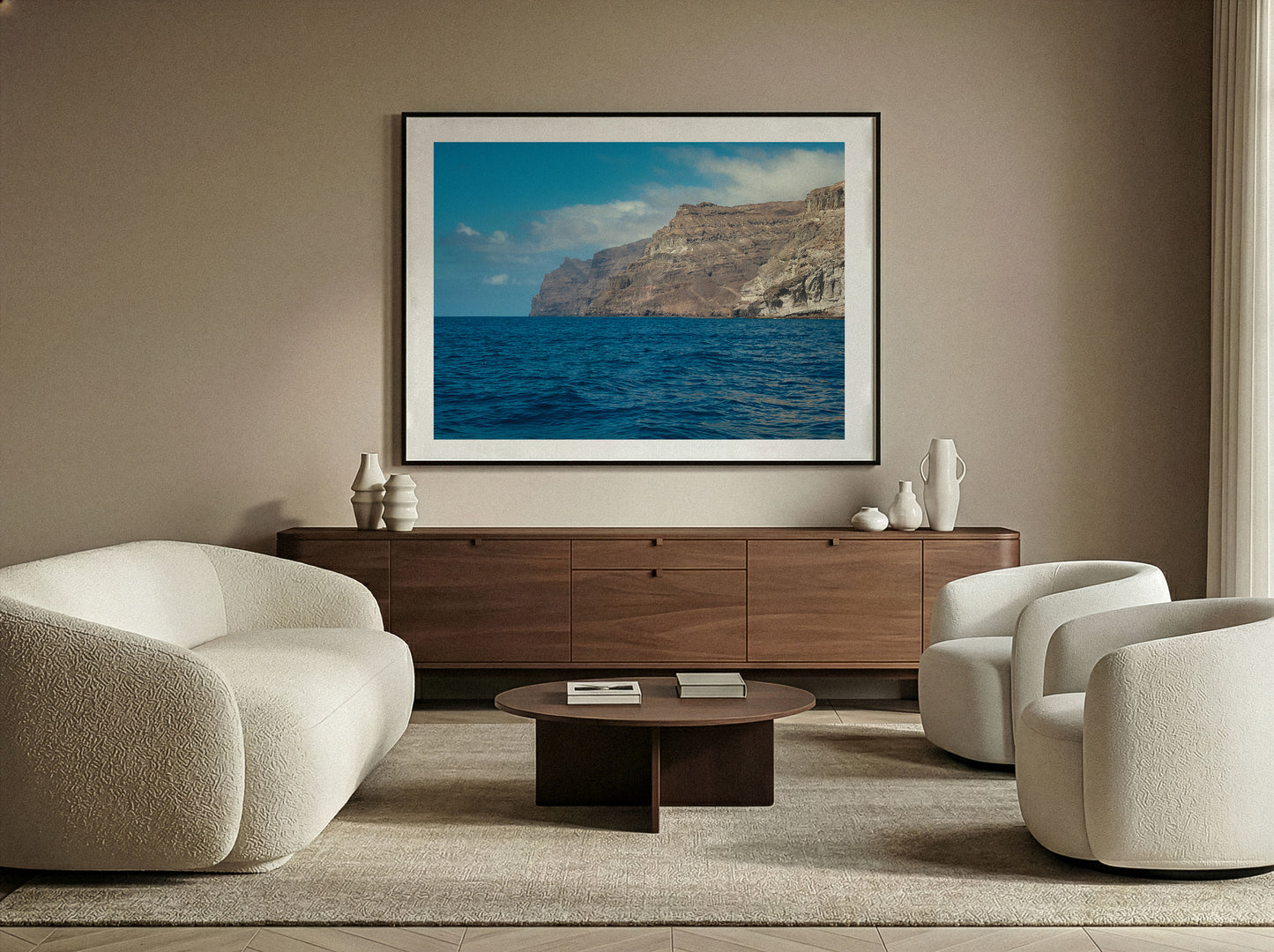 Fine Art Print of a coastal scene in a Modern living room with beige chairs, wooden cabinet.