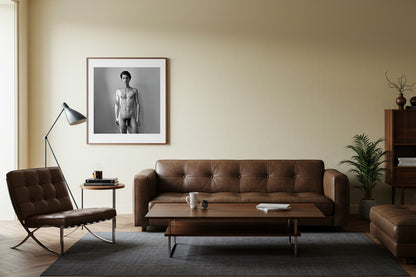 framed black and white male nude on wall