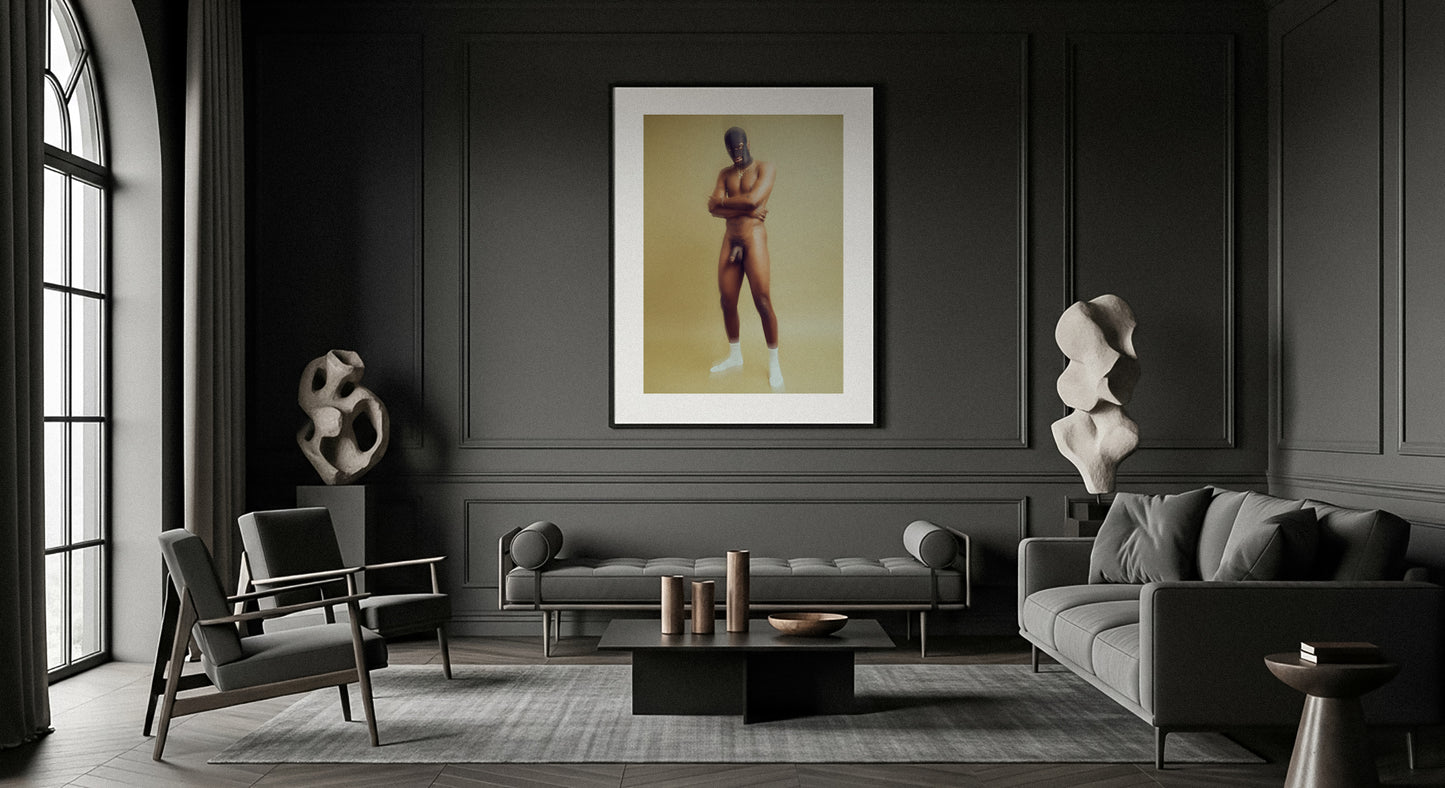 Modern living room with gray walls, furniture, and a museum quality framed artwork of a nude male wearing a mask