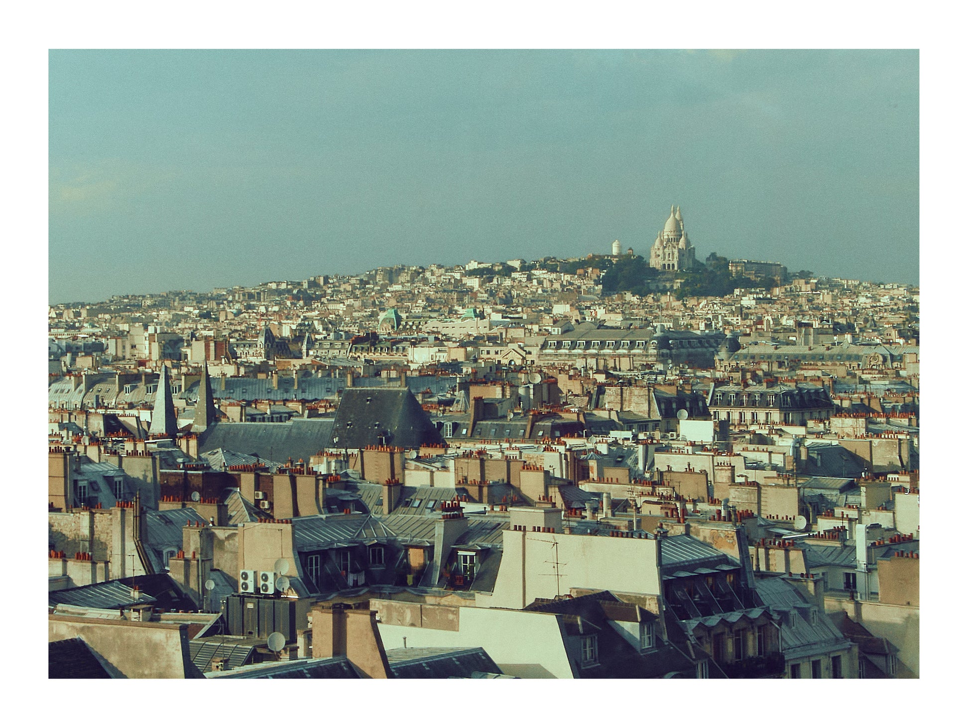 Paris Cityscape with a prominent building on a hill under a clear sky