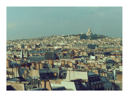 Paris Cityscape with a prominent building on a hill under a clear sky