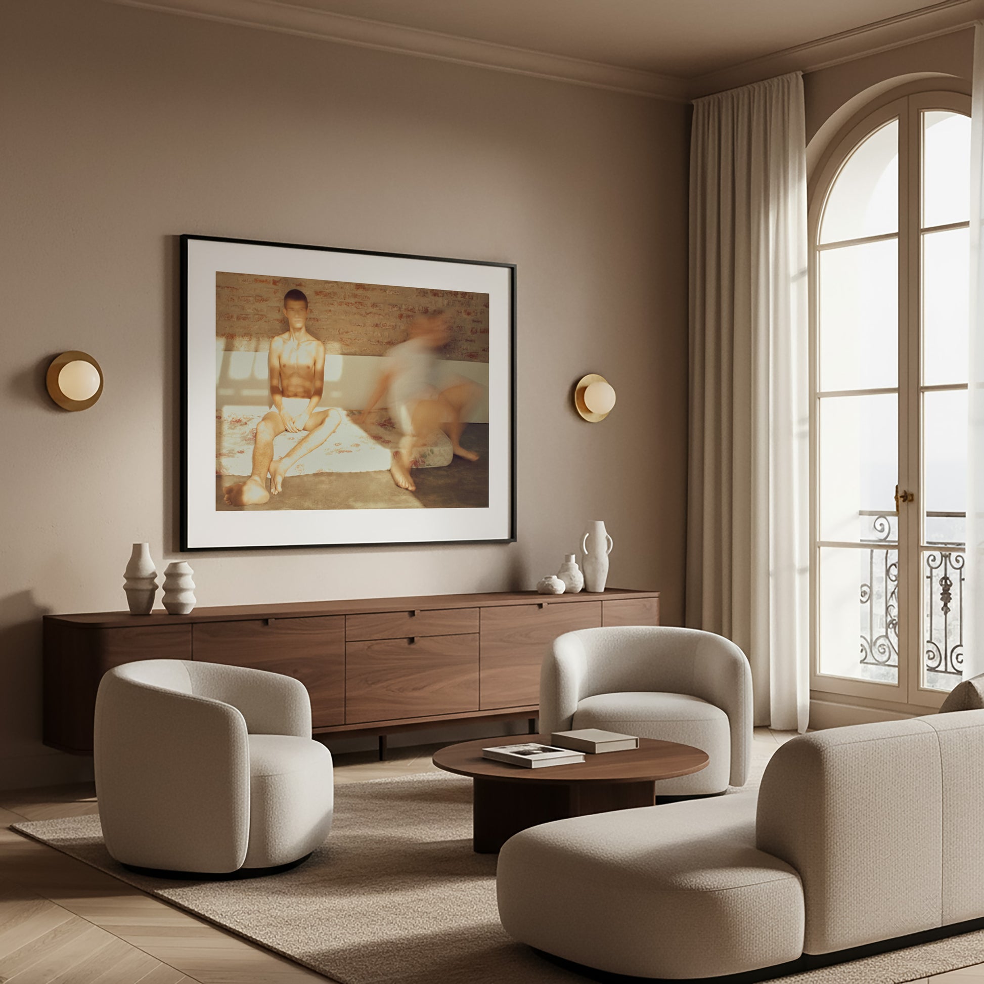 Modern living room with beige sofa, armchairs, and wooden cabinet and framed contemporary fine art photography