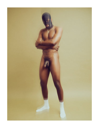 Fine Art Photograph of a Masked Naked man standing with arms crossed against a green background