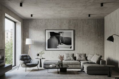framed black and white nude photo hanging on wall
